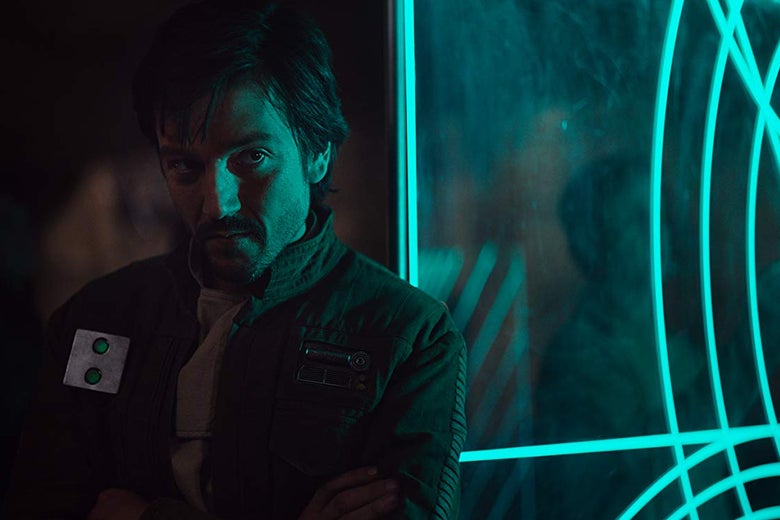 Diego Luna stands in the green light of a nearby monitor.